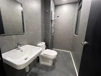 a bathroom with a white sink and a toilet at Rainbowstudioklcc in Kuala Lumpur
