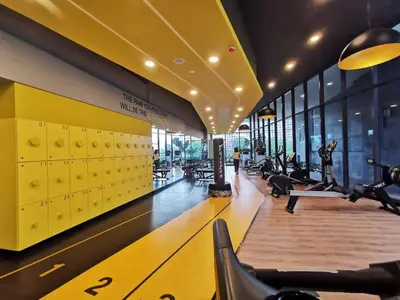 a gym with treadmills and machines in a building at Rainbowstudioklcc in Kuala Lumpur