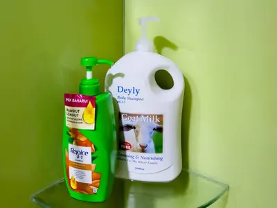 a bottle of laundry detergent next to a detergentinyl at Sky Suite KLCC in Kuala Lumpur