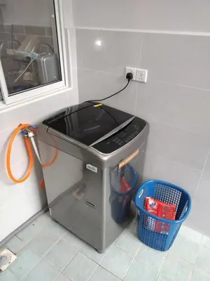 a kitchen with a appliance plugged into a wall at Homestay Spacious Condo Gurney Heights 5min to KLCC in Kuala Lumpur