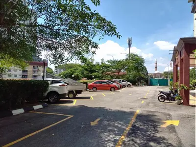 a parking lot with cars parked in it at Homestay Spacious Condo Gurney Heights 5min to KLCC in Kuala Lumpur