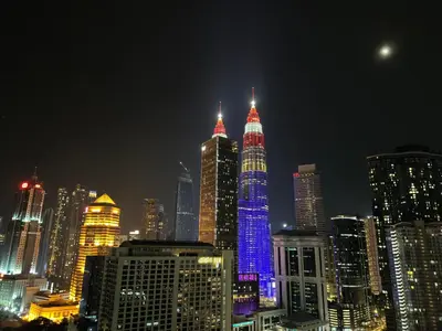 a city skyline with tall buildings at night at ABC PRiVATE RooM Klcc in Kuala Lumpur