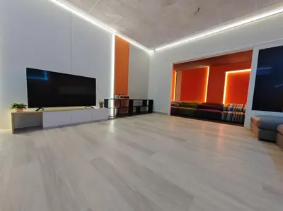 a large living room with a flat screen tv at Taman Duta KL Deluxe Villa by uBook in Kuala Lumpur