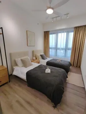 a bedroom with two beds and a large window at Agile Bukit Bintang KLCC City Centre Kuala Lumpur Malaysia in Kuala Lumpur