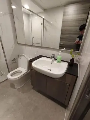 a bathroom with a sink and a toilet and a mirror at Agile Bukit Bintang KLCC City Centre Kuala Lumpur Malaysia in Kuala Lumpur