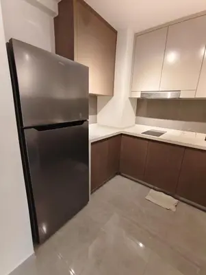 a kitchen with a stainless steel refrigerator at Agile Bukit Bintang KLCC City Centre Kuala Lumpur Malaysia in Kuala Lumpur