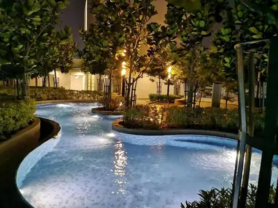 a swimming pool in a building at night at Pool World at Robertson Residence Kuala Lumpur in Kuala Lumpur