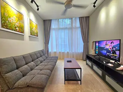a living room with a couch and a flat screen tv at Apartment Sky by MonoSuites KLCC in Kuala Lumpur