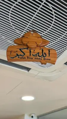 a sign on the ceiling of a room with two surfboards at South of The Clouds HOTEL KL Sentral \u5409\u9686\u5761\u5f69\u4e91\u4e4b\u5357\u9152\u5e97-\u4e2d\u592e\u8f66\u7ad9\u5e97 in Kuala Lumpur