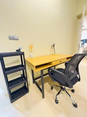 an office with a desk and a black chair at Family comfy 2BR at Star residence2 KLCC in Kuala Lumpur