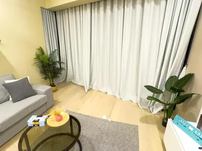 a living room with a couch and a table at Family comfy 2BR at Star residence2 KLCC in Kuala Lumpur