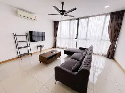 a living room with a couch and a flat screen tv at PROMO Connected train 3 Bedrooms - Above Mall 25 in Kuala Lumpur