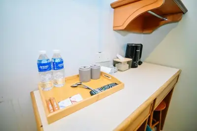 a counter with two bottles of water on it at Swing & Pillows - Petaling Street Kuala Lumpur in Kuala Lumpur