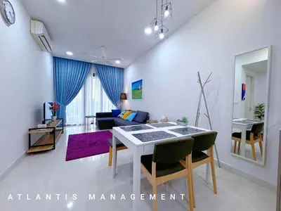 a living room with a table and a couch at KL Eco City Luxury 2 Bedrooms Apartment, Walking Distance to Mid Valley & The Garden & LRT in Kuala Lumpur