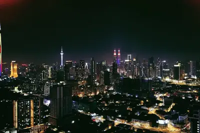 a night view of a large city at night at KLCC view 1BR service suite with Balcony Trion B5311 KL in Kuala Lumpur
