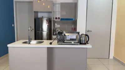 a kitchen with a sink and a toaster on a counter at KLCC view 1BR service suite with Balcony Trion B5311 KL in Kuala Lumpur