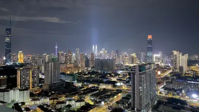 a city skyline at night with lit up buildings at KLCC view 1BR service suite with Balcony Trion B5311 KL in Kuala Lumpur