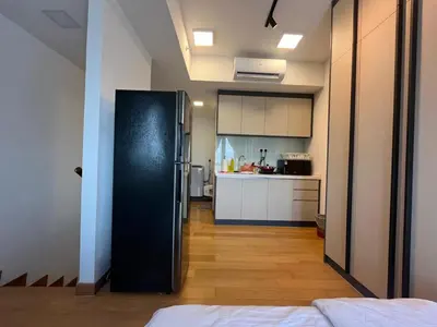 a black refrigerator in a room with a kitchen at THE COLONY INFINITUM Sweet Home SR in Kuala Lumpur