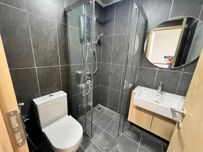 a bathroom with a shower and a toilet and a sink at THE COLONY INFINITUM Sweet Home SR in Kuala Lumpur