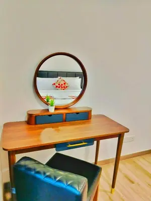 a wooden table with a mirror on top of it at Lila Suites Agile, Bukit Bintang ,KLCC in Kuala Lumpur