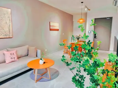 a living room with a couch and a table at Lila Suites Agile, Bukit Bintang ,KLCC in Kuala Lumpur