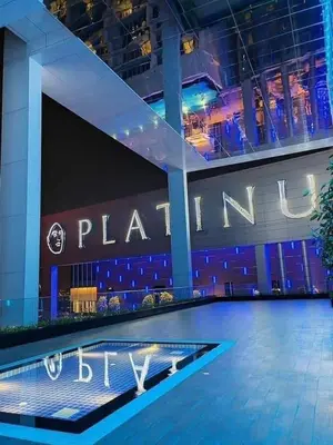 a large building with a sign on the side of it at The suits klcc in Kuala Lumpur