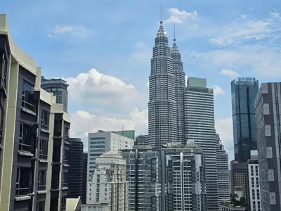 a view of a large city with tall buildings at Resort Style Haven 3BR6pax St Mary KLCC Twin Towers View in Kuala Lumpur