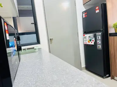 a kitchen with a black refrigerator next to a window at MVD41#Family Suite 8pax 3 Rooms M Vertica Velocity Mall Cheras IKEA Mytown Short Walk to MRT & LRT Maluri in Kuala Lumpur