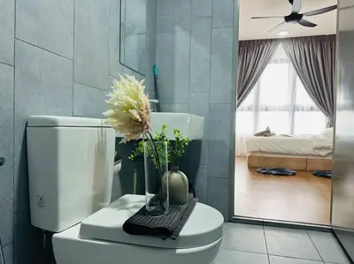 a bathroom with a toilet with a vase of flowers on it at MVD41#Family Suite 8pax 3 Rooms M Vertica Velocity Mall Cheras IKEA Mytown Short Walk to MRT & LRT Maluri in Kuala Lumpur