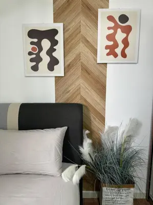 a bedroom with a bed and two pictures on the wall at PavKlccTrxVelo ,MrtLrt ,13PAX ,4R2B ,Free KLCCPavTRXVelocity X MrtLrt X 13PAX X 4R2B X Free 4CPark in Kuala Lumpur