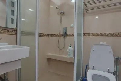 a bathroom with a shower and a toilet and a sink at Fahrenheit 88, Bukit Bintang 10 in Kuala Lumpur