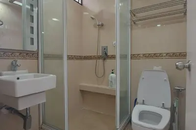 a bathroom with a shower and a toilet and a sink at Fahrenheit 88, Bukit Bintang 10 in Kuala Lumpur