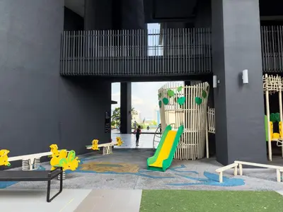 a playground with a slide in a building at 5 pax - Bangsar South - 7 mins drive to Mid Valley in Kuala Lumpur