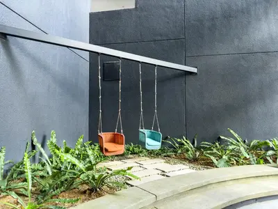 two buckets are hanging on a wall at 5 pax - Bangsar South - 7 mins drive to Mid Valley in Kuala Lumpur