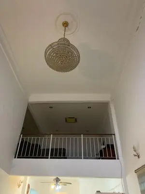 a chandelier hanging from a ceiling in a room at Cityscape KL in Kuala Lumpur
