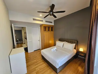 a bedroom with a bed and a ceiling fan at City Vibe Oasis St Mary Pavilion KLCC 3Bed6pax in Kuala Lumpur