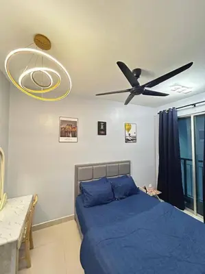 a bedroom with a bed and a ceiling fan at Setapak KL Apt 3 Room 8 pax in Kuala Lumpur