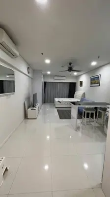 a living room with a table and a dining room at KL City Centre in Kuala Lumpur