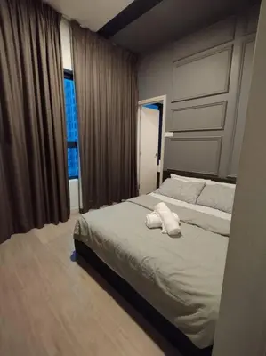 a bedroom with a bed with two towels on it at apartment for classic lover in Kuala Lumpur