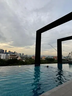 a swimming pool with a view of the city at Modern Luxury Apartment, Sunway, TRX in Kuala Lumpur