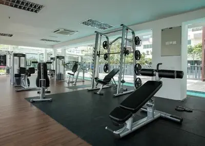 a gym with several treadmills and machines in a building at cozy 3 bedroom 6PAX setapak central mall in Kuala Lumpur