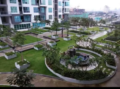an aerial view of a park in front of a building at Cozy studio family lake view SETAPAK CENTRAL MALL in Kuala Lumpur