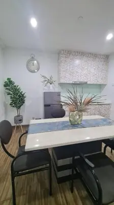 a dining room with a table and two chairs at Cozy studio family lake view SETAPAK CENTRAL MALL in Kuala Lumpur