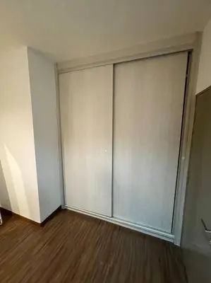 an empty room with a large sliding glass door at Cozy lake view at top of setapak central mall in Kuala Lumpur