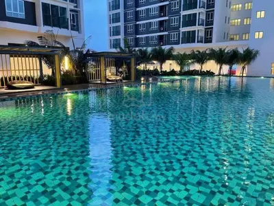 a large swimming pool in front of a building at RSJ Homestay at Setapak - Studio in Kuala Lumpur