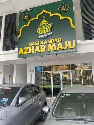 two cars parked in front of aaza har mandu store at RSJ Homestay at Setapak - Studio in Kuala Lumpur