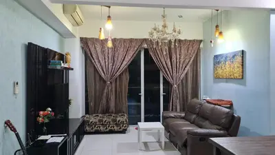 a living room with a couch and a chandelier at Hostel At Regalia Residence in Kuala Lumpur