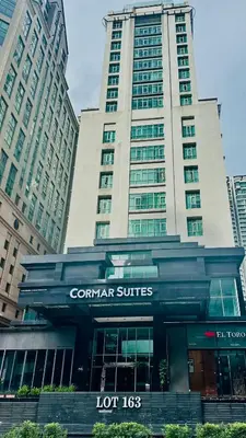 a building with a sign in front of it at SOHO SUITES KLCC by DREAMS in Kuala Lumpur