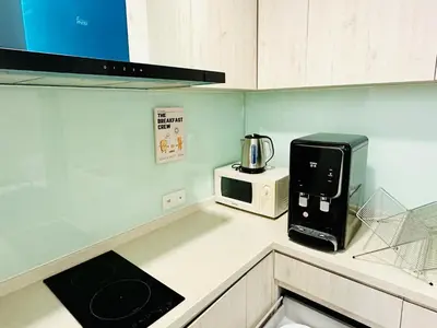 a kitchen with a coffee maker and a microwave at V Residence Suites-3A in Kuala Lumpur