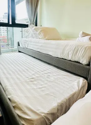 two beds sitting next to each other in a room at V Residence Suites-3A in Kuala Lumpur